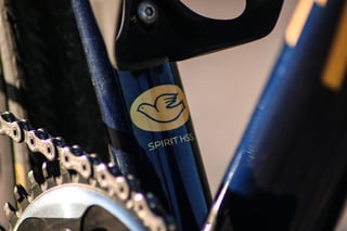 Columbus Spirit HSS decal with a dove logo on the navy seat tube of the Wish One SUB, above the chainring.