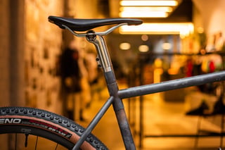 Seat tube and top tube junction of the Belle Cycles A.T.E.R. with the titanium seat mast and a Fabric saddle.