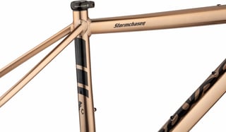 Salsa Stormchaser top tube logo, seat tube graphics and seat collar in close-up.