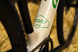 Green Handmade in Colorado 2020 badge on the down tube of the Alchemy E-Ronin.