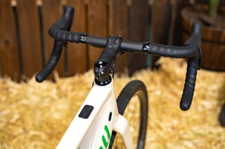 Drop bars, stem and top tube control button on the Alchemy E-Ronin e-gravel bike.