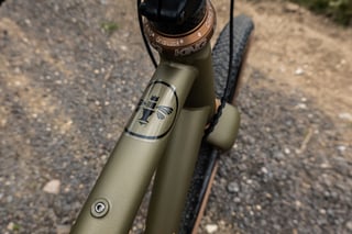 Chris King GripLock headset and bee head badge on the Bombtrack Hook EXT's head tube.