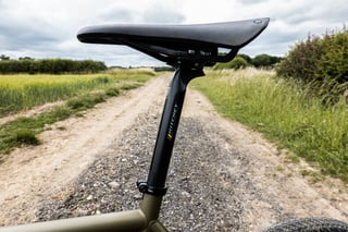 Ritchey WCS Carbon Link Flexlogic seatpost and Brooks Cambium C13 saddle on the Bombtrack Hook EXT on a farm track.