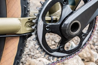 SRAM Force 1 chainring and crank on the Bombtrack Hook EXT, beside the chainstay stamped with the brand name.