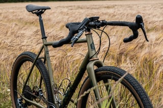 Front three-quarter view of the Bombtrack Hook EXT showing SRAM levers, Wahoo computer and Teravail tyres.