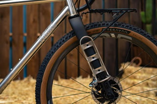 ENVE Adventure Fork on the Horse Cycles Monster Gravel, with a cargo cage mounted on the leg and a Teravail Ehline tyre.