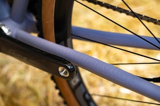 Close-up of the lilac chainstay on the Speedvagen GTFO, with the builder's Portland, Oregon text embossed on it.