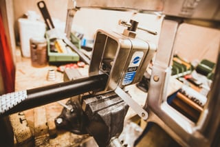 New flat bar clamped in a Park Tool SG-7.2 saw guide in a vice, ready to be cut to length for the Escapade.