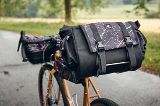 Wizard Works Shazam saddle bag in black and splatter fabric, held on a Carradice support on the Fairlight Faran.