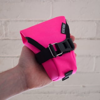 Medium Teeny Houdini in fluro pink, with magnetic buckle and a rear strap loop.