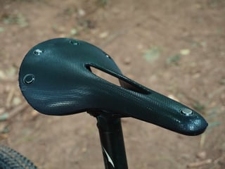 Brooks Cambium C17 Carved All Weather saddle in black, seen from above on a black seatpost.