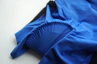 Zigzag stitching around the chamois of the blue Machines For Freedom Foundations liner shorts, close up.