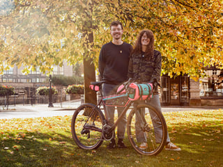 Harry Major and Ve of Wizard Works stand under autumn trees with a Stayer UG loaded with splatter-pattern bags.
