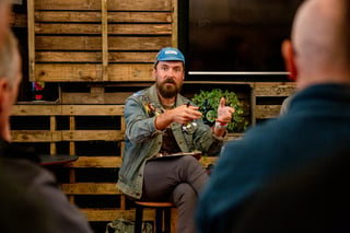 Jon Woodruff of Two Tone Amsterdam gestures as he hosts a panel talk at Bespoked 2021.