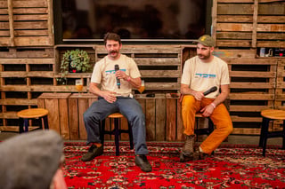 Ted James and Peter Georgallou speak into microphones during their framebuilding panel at Bespoked 2021.