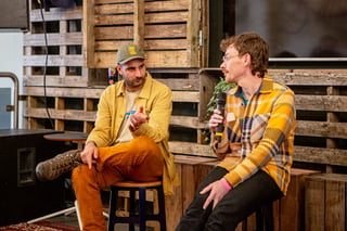 Harry Major of Wizard Works and Peter Georgallou sit on stools talking bikes and bag making at Bespoked 2021.