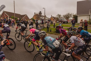 Trek-Segafredo and FDJ riders in the Women's Tour of Britain bunch climb Hambro Hill past phone-waving spectators.