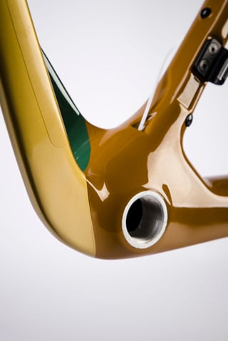 Chapter2 AO frame bottom bracket shell, where the bronze and green paint meet at the chainstay junction.