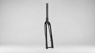 Seido BANJO carbon fork in gloss black, standing upright on a grey background with its uncut steerer.