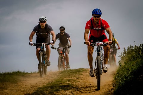 Mountain bikers kick up dust on a moorland track at Yorkshire True Grit 2018 in North Yorkshire.