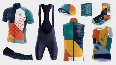Victory Chimp Stampen Collection team issue kit in navy, teal and orange, with jersey, bibs, gilet, cap and socks.