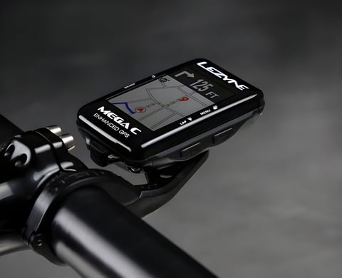 Lezyne Mega C GPS cycling computer on a handlebar mount, showing a turn-by-turn navigation map.