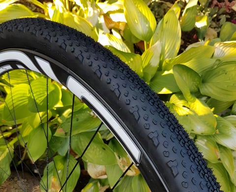 Goodyear Connector Ultimate tubeless gravel tyre on a wheel, close-up of the tightly spaced tread knobs.