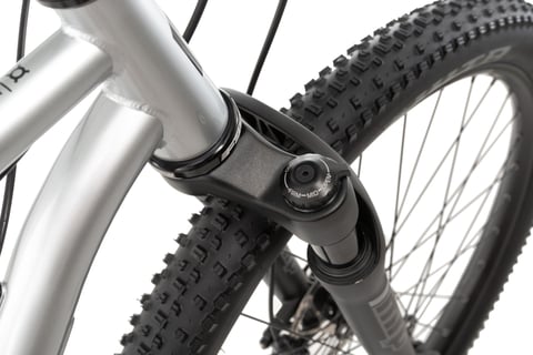 MRP Baxter suspension fork crown on the Bombtrack Hook ADV, with its firm, mid and open compression dial beside a WTB tyre.