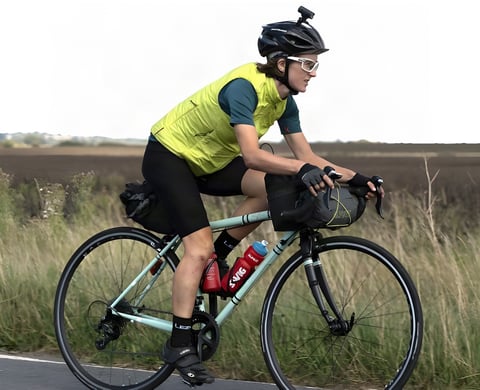 Ede Harrison, fastest woman at Transcontinental Race No6, rides her pale green Light Blue Wolfson with bikepacking bags.