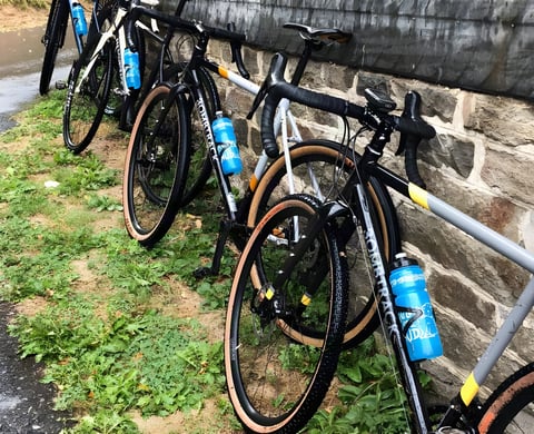 Bombtrack gravel bikes with tan-wall tyres leant against a stone wall at the Groundwork press event near Cologne.