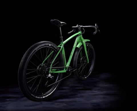 Mason InSearchOf (ISO) monstercross bike in green, rear three-quarter view against a black studio backdrop.