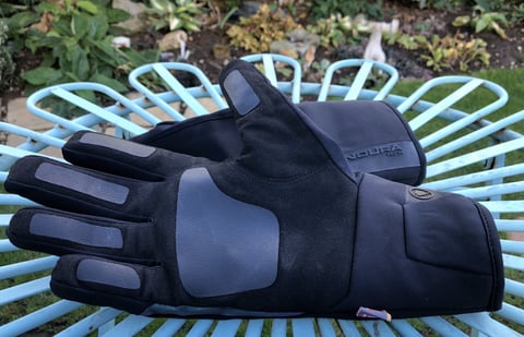Endura Pro SL Primaloft waterproof gloves in black on a garden chair, one palm up showing the rubberised grip patches.