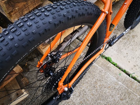 Surly ECR rear triangle with a SRAM crankset, cassette and the large knobbly rear tyre, from above.