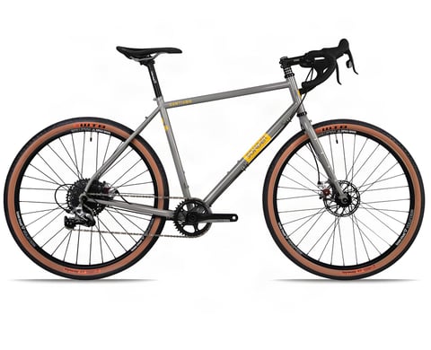 Grey Sonder Santiago steel touring bike with drop bars, disc brakes and tan-wall 650b tyres, side view.