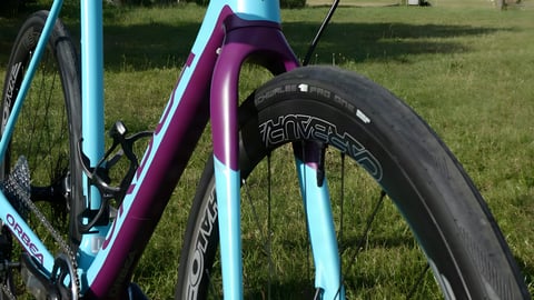 Halo Carbaura RCD carbon wheel fitted with a Schwalbe Pro One tyre on a turquoise and purple Orbea Terra gravel bike.