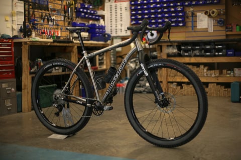 Smokestone Mr Harry titanium drop-bar bike on Vittoria Mezcal tyres with a Whisky fork, in the Slam 69 workshop.