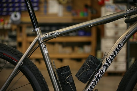 Mr Harry decal on the top tube of the Smokestone titanium frame, with Smokestone lettering on the down tube.