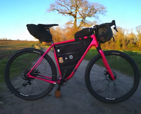 Pink Salsa Cutthroat packed with frame, saddle and bar bags ready for the Atlas Mountain Race.