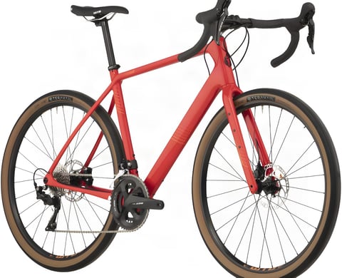 Red 2020 Salsa Warroad road bike with Shimano 105 cranks and tan-wall Teravail tyres, studio shot.