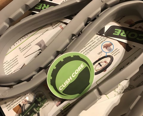 CushCore Gravel-CX tyre inserts in their box with instruction sheets, a green CushCore sticker and valves.