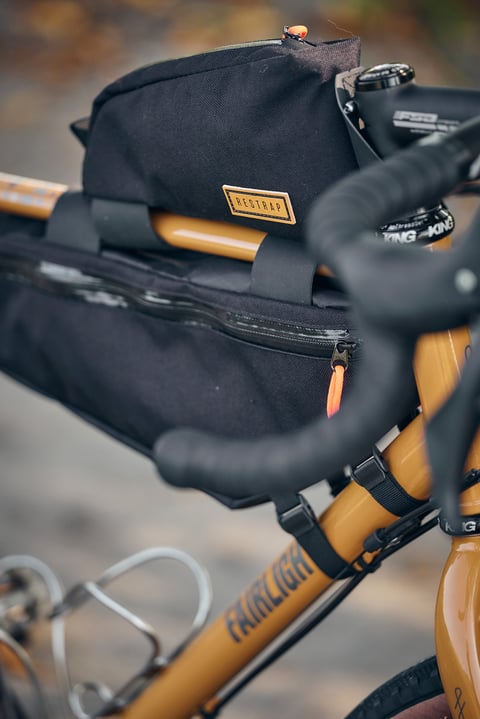 Restrap top tube bag and frame bag on a Winter Bracken Fairlight Faran 2 beside the Chris King headset.