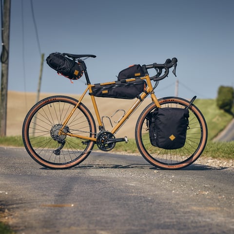 Side view of the Winter Bracken Fairlight Faran 2 touring build with Restrap bags and 47mm WTB Byway tyres.