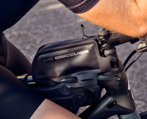 Shimano PRO Discover Team top tube bag mounted behind the stem of a gravel bike.