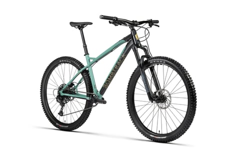Bombtrack Cale AL in mint green and black with RockShox fork, front three-quarter studio view.