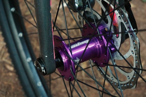 Purple Hope front hub with a 160mm disc rotor and carbon fork leg on the Planet X Tempest.