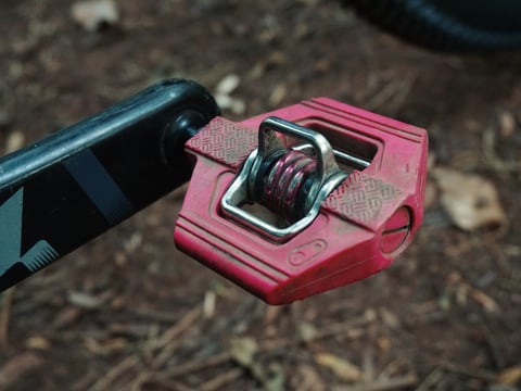 Red Crank Brothers Candy 1 pedal on a black SRAM crank arm of the Planet X Tempest.