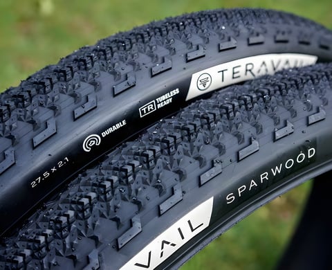 Pair of Teravail Sparwood Durable 650b x 2.1 tyres beaded with water, showing the chevron tread and sidewall labels.