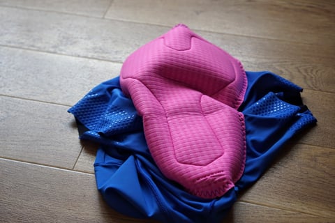 Pink chamois pad of the Foundations liner shorts, with silicone grip dots on the blue leg hems.