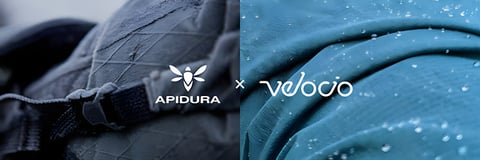 Apidura and Velocio logos over close-up shots of black and teal wet-weather fabric.