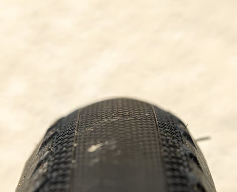 Close-up of the shallow rolling-surface tread on a Maxxis Receptor 40mm gravel tyre.